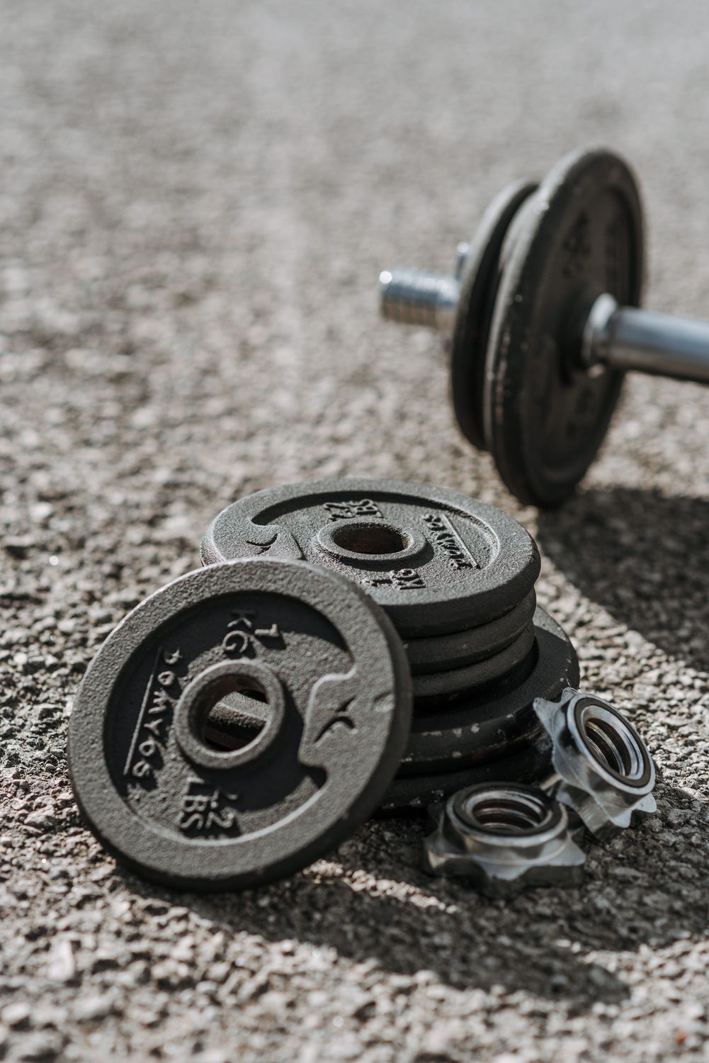 Iron weight plates on textured ground