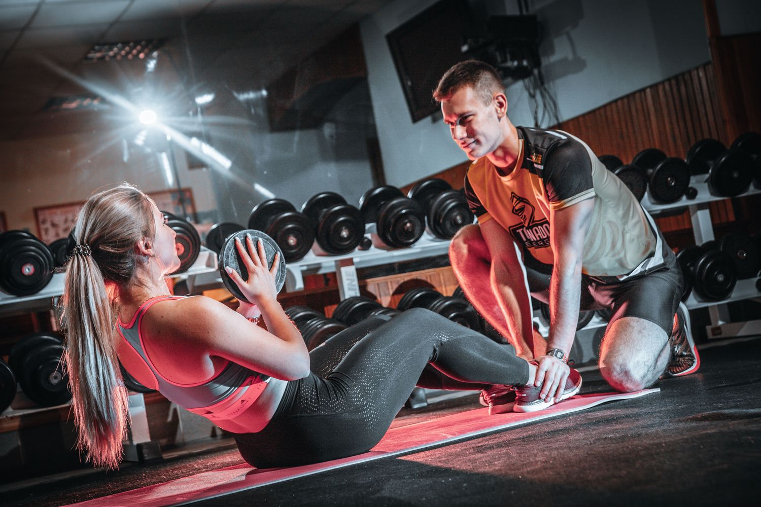 Weighted sit-up with a partner holding the feet